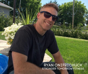 Ryan sitting among the flowers in his garden