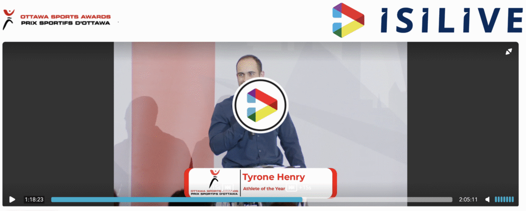 A screenshot of the webcast broadcast of the Ottawa Sports Awards shows Tyrone Henry on the stage at the event